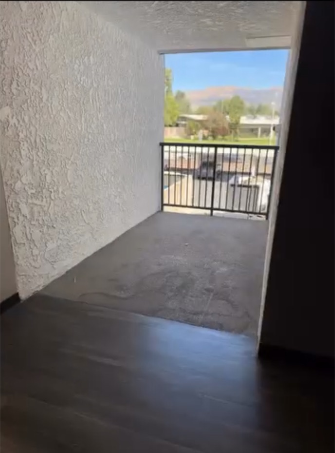Same apartment patio and doorway cleared after the cleanout
